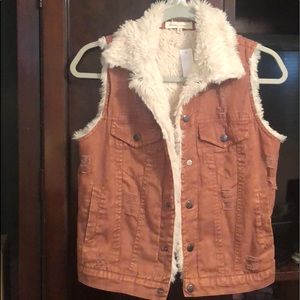 Gilded intent from buckle vest